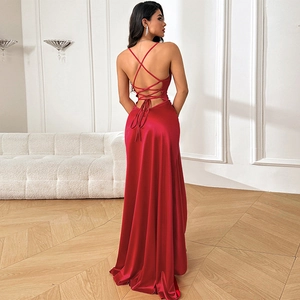 Elegant red backless satin evening gown with cross strap detail and side slit design