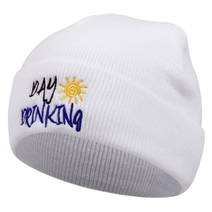 Detail of white knit beanie featuring Day Drinking embroidery and sun icon detail