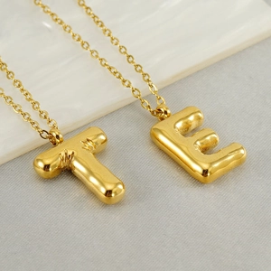 Chubby 3D bubble initial T and E letter necklaces in polished gold stainless steel