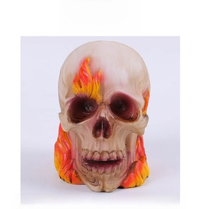 Detailed resin skull ornament featuring bright flame texture and realistic bone carvings