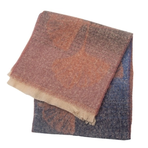 Detail of soft jacquard scarf with maple leaf pattern and double-sided color design