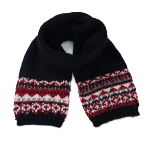 Close-up of Fair Isle vintage pattern on thick black knit scarf with colorful knit details