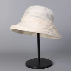 Lyocell linen bucket sun hat in cream white with tiered fabric and pearl ribbon detail