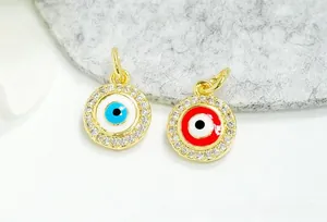 Macro shot of 18K gold plated evil eye pendants with micro-pave cubic zirconia accents