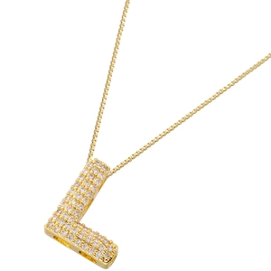 Macro detail of gold plated letter L pendant necklace with cubic zirconia micro-paving