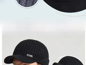 Detailed close-up of winter knit peaked cap with fleece ear flaps and JEANS embroidery