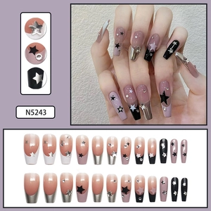 Detail view of N5243 press-on nails in long coffin shape with star pattern and rhinestones