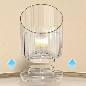 Rotating makeup brush holder with high transparency striped acrylic and gold trim detail