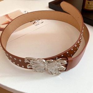 Brown leather belt with silver butterfly buckle and round metallic stud details
