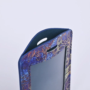 Detailed close-up of blue PU leather ID card holder with gold geometric pattern