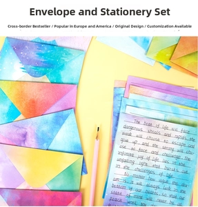 Artistic watercolor gradient stationery set with colorful envelopes and lined writing paper