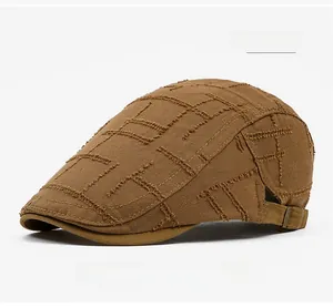 Close-up of coffee brown vintage distressed flat cap with retro ripped fabric details