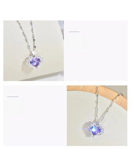 Detail showing a heart-shaped purple crystal pendant with micro-inlay stones on silver chain