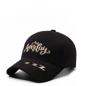 Detail of baseball cap featuring golden Monday embroidery and ZZZ brim decoration