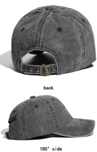 Detail view of washed cotton baseball cap with adjustable bronze metal buckle back
