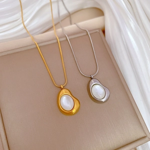 Minimalist cat eye bean necklace in gold and silver finish with sleek snake chain