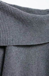 Detail shot of high-quality dark grey ribbed knit fabric with soft texture and elasticity