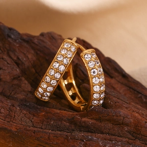 Detailed macro shot of 18K gold plated hoop earrings with double-row zircon inlay