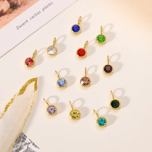 Detailed set of twelve colorful birthstone charms with gold bezels and rhinestone facets