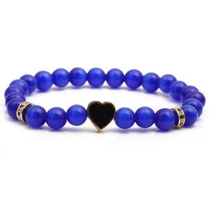 Blue beaded bracelet featuring a gold-edged black heart pendant and sparkling accent rings