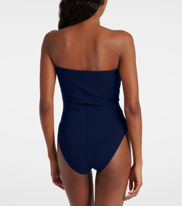Back view of a navy blue backless one-piece swimsuit featuring a strapless design