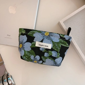 Floral mini storage pouch with blue flower pattern and zipper for cosmetics or coins