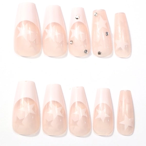 Classic pink coffin press-on nails with white stars and sparkling rhinestones
