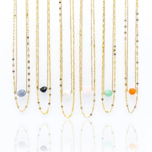 Set of six vintage gold-toned double-layered necklaces with colorful natural stone pendants