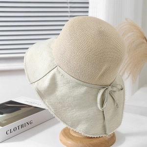 Women's straw cloche hat with sage green wide brim and delicate lace trim detail