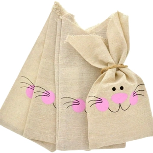 Detail of burlap Easter bunny bags with drawstring ears and cartoon rabbit face print