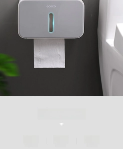 Detail of waterproof wall-mounted toilet paper holder with transparent window in gray matte