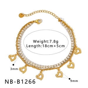 Detailed view of golden double-layer bracelet with hollow heart charms and zircon stones