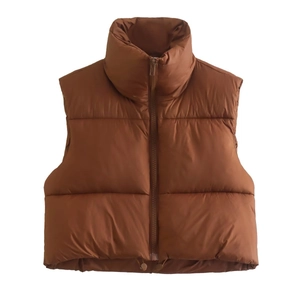 Detailed view of brown padded vest with high collar zipper and adjustable drawstring hem