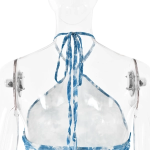 Detailed back view of blue tie-dye halter neck dress featuring adjustable tie straps