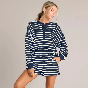 Detail of navy striped henley long sleeve top and matching shorts in a cozy knit fabric