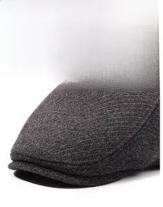 Close-up of thick textured knit fabric and stiff brim on a winter outdoor ear-protection cap