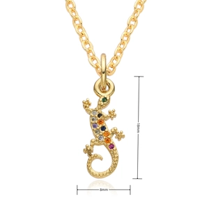 Macro detail of a 18mm golden lizard pendant with colorful micro-inlaid zircons
