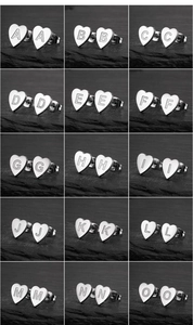 Detailed view of heart-shaped stainless steel earrings with laser-engraved letters