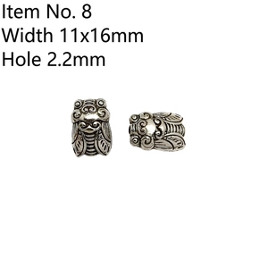 Detailed view of vintage cicada beads in silver finish for DIY jewelry and accessories