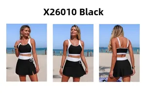 Three-way view of black two-piece swimwear X26010 with white trim and side slit skirt