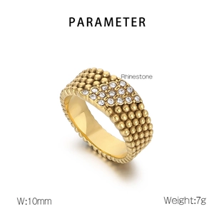 Macro shot of 10mm wide gold-tone stainless steel ring featuring five rows of rhinestones