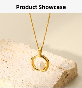 Detail of 18k gold plated irregular ring pendant with pearl on a stainless steel chain