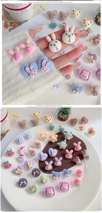 Close-up of cute flocked cartoon animal stud earrings with soft plush texture details