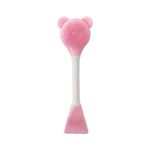Detailed close-up of pink bear-shaped silicone cleansing brush with massage bristles