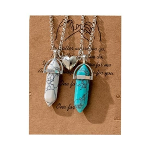 Detail of magnetic heart pendants and hexagonal crystal stone necklaces on card