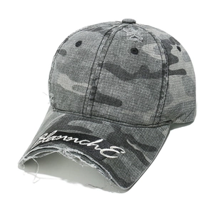 Close-up of distressed grey camo baseball cap featuring white Blanch E embroidery