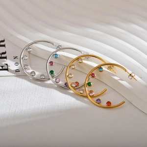 Luxurious C-shaped hoop earrings featuring colorful cubic zirconia in gold and silver finish