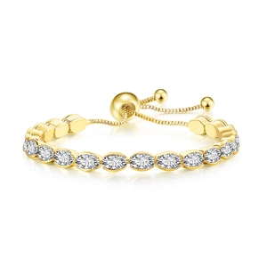 Detail view of adjustable gold tennis bracelet with oval white cubic zirconia stones