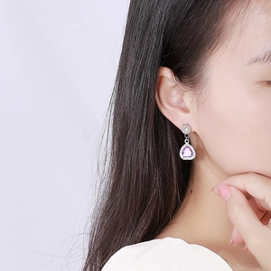 Elegant silver earrings featuring purple heart-shaped stones and shimmering cubic zirconia