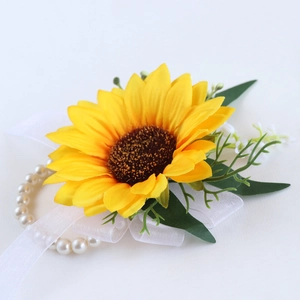 Sunflower wedding corsage with pearls and white chiffon ribbon on white background